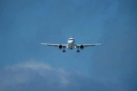 Airplane in the cloudy sky.