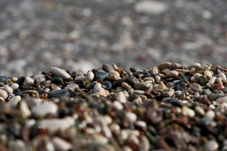 Colorful pebble stones on the beach, pebbles on the beach of Antalya, close-up, backgroundの写真素材