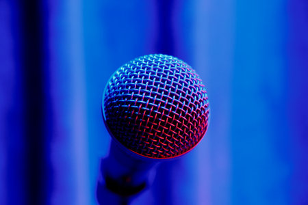 microphone in the concert hall, close-up, blue backgroundの写真素材