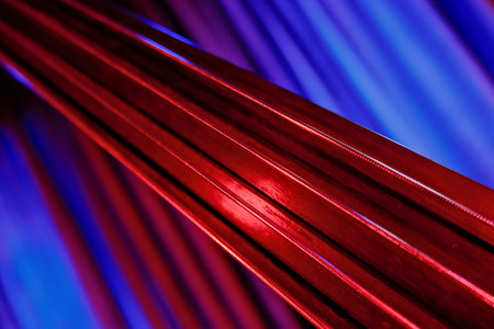 Close-Up of Strings with Red and Blue Dramatic Lightingの写真素材