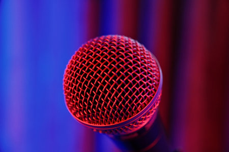 Microphone on stage, close-up. Blue stage background.の写真素材