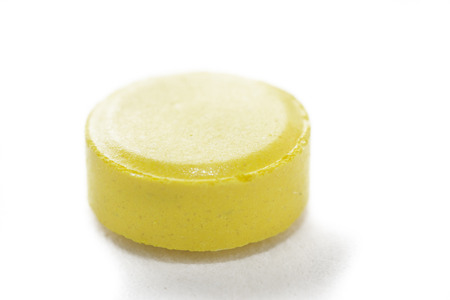 yellow tablet on white background, isolateの写真素材
