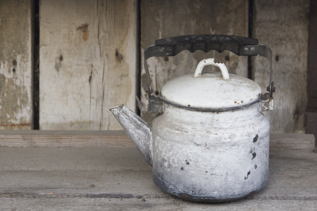 old kettle on the boardの写真素材
