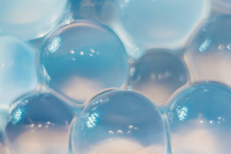 Abstract texture, crystalline balls of hydrogel for the background. Hydrogel beads. Close up and out...