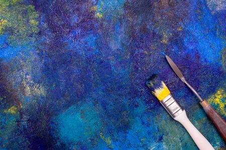 Blue oil paint mixed and brush, palette knife . Abstract texture. Place for text.の写真素材