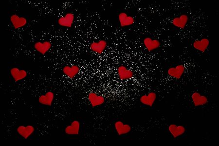 Abstract Valentine's day background with red hearts and sparkles. Top view, copy space, pattern.の写真素材