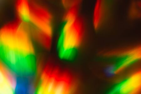 Aggressive colors. Abstract composition red yellow green blue on black background macro.