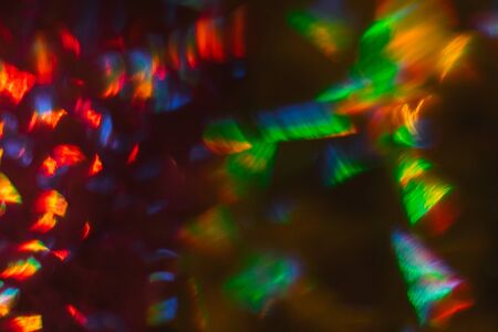Aggressive colors. Abstract composition red yellow green blue on black background macro.