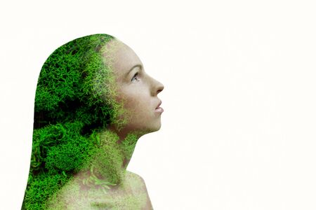Double exposure portrait of young woman and green moss as veins. Isolated on white background. Ecological concept. Place for text.の写真素材