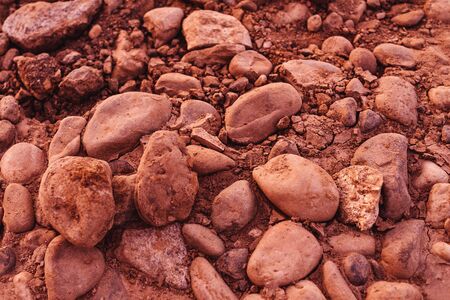 Stones background in sunset light. Orange brown color, texture.の写真素材