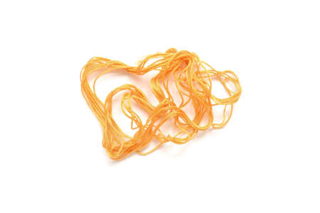Tangled orange thread on white background isolated.