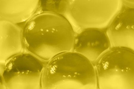Abstract yellow texture, crystalline balls of hydrogel for the background. Hydrogel beads. Close up and out of focus.の写真素材