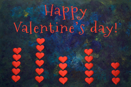 Valentines day concept, lettering. Blue oil paint mixed. Columns of hearts.の写真素材