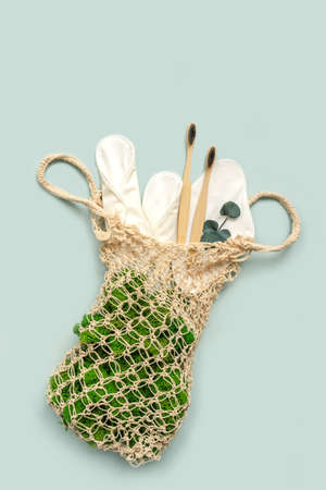 Zero waste supplies for personal hygiene. Eco bamboo toothbrush, reusable cloth menstrual pads, natural cotton bag. Sustainable lifestyle. Plastic free concept.の写真素材
