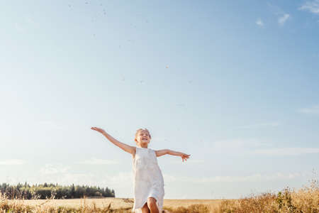 Portrait of happy smiling girl. Sky background.の写真素材