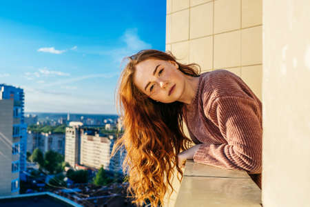 Happy woman with long hair in sunshine.の写真素材
