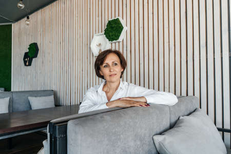 Senior businesswoman have a rest in cafe.の写真素材