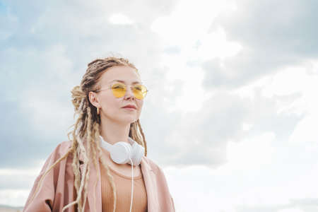 Woman with dreadlocks outdoor. Sunny summer day.の写真素材