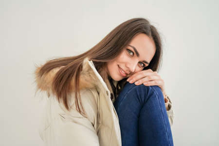Young woman wearing jacket on white background.の写真素材