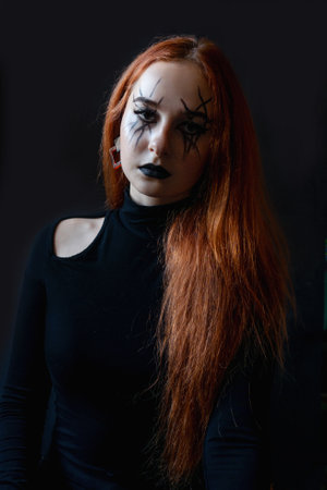 Halloween witch woman with long hair and make-up.