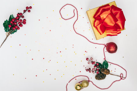 Golden gift box with bow on white.の写真素材