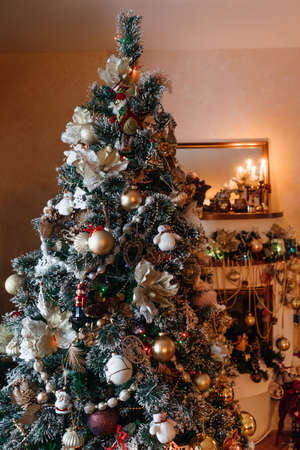 Beautiful holdiay decorated room with Christmas tree and fireplace. Vertical.の写真素材