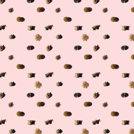 Trendy pattern from golden baubles on pink background. Christmas concept.の写真素材