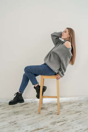 Young woman wearing sweatshirt on white background.の写真素材