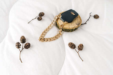 Golden bijouterie chain bracelet on white background.の写真素材