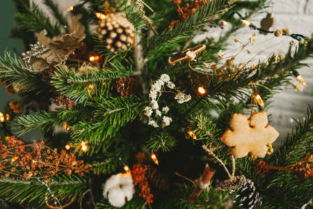 Beautiful decorated Christmas tree with natural decor.の写真素材