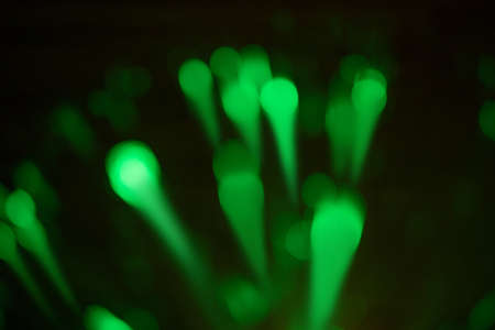 Blurred green light splash, bokeh effect background. Copy space. Abstract background.の写真素材