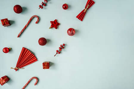 Red Christmas baubles decoration on blue background.の写真素材