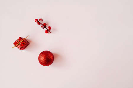 Red Christmas baubles decoration on pink background.の写真素材