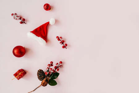 Red Christmas baubles decoration on pink background.の写真素材