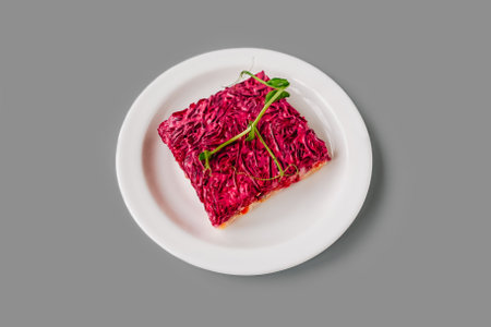 Russian herring salad under a fur coat on gray background. Front view.の写真素材