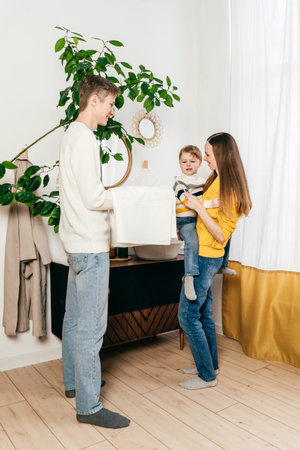 Family with little son In Bathroom with toothbrush and towel. Vertical.の写真素材