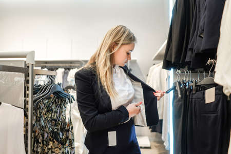 Woman in the mall tries on Blazer.の写真素材