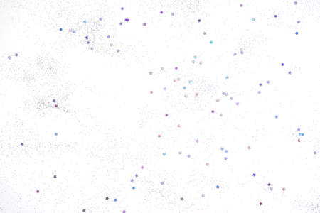 White background with small purple holographic sparkles.の写真素材