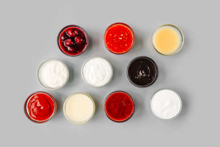 Various sauces in small sauce bowls. Top view.の写真素材
