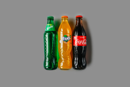 Russia, Perm - February 11, 2021: Coca-Cola, Fanta and Sprite bottles Isolated on gray background. Coca-Cola Company drinks.のeditorial素材