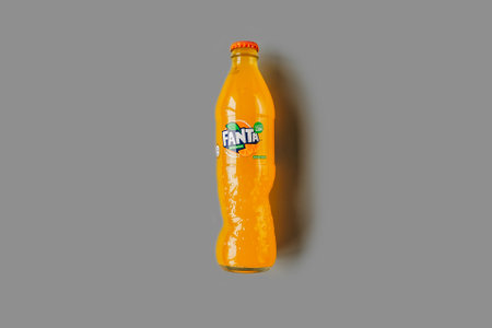 Russia, Perm - February 11, 2021: Fanta bottle Isolated on gray background. Coca-Cola Company...