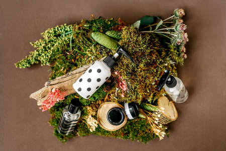 Cosmetics bottles with cream. Natural organic cosmetics, alternative medicine, herbal essence, sustainable concept. Top view.の写真素材