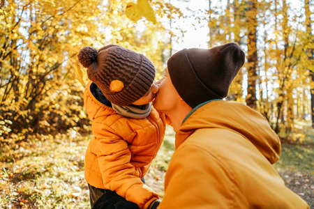 Father and little son kissing in the forest. Love and tenderness cncept.の写真素材