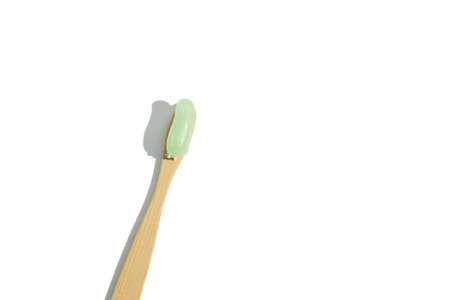Natural bamboo toothbrush on white background isolated. Overhead, copy spaceの写真素材