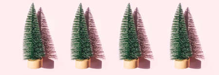 Christmas tree toys on pink background. Christmas holiday celebration concept. Web banner.の写真素材