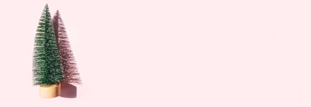 Christmas tree toy on pink background. Christmas holiday celebration concept. Web banner with copy space.の写真素材