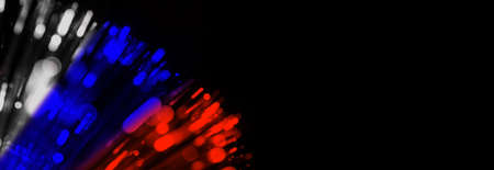 Blurred white blue red splash, bokeh light effect background. Copy space. Black background with copy space.の写真素材