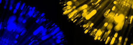 Blurred blue yellow splash, bokeh light effect background. Copy space. Black background with copy space.の写真素材