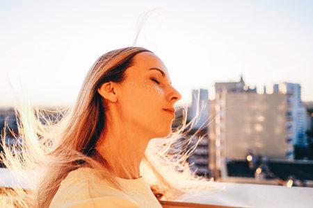 Young relax caucasian woman stand in balcony.