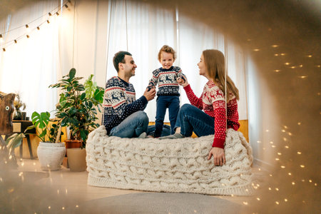 Happy family have fun on bed. Home.の写真素材